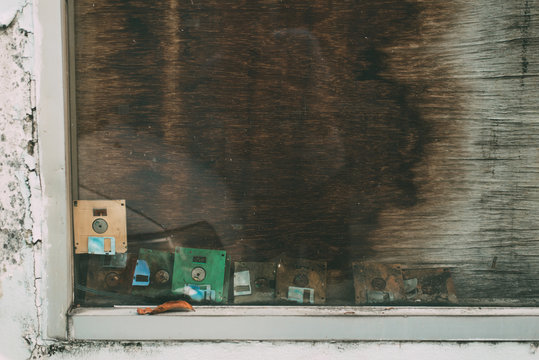 Old Floppy Disks Forgotten and Stuck in a Window