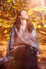 beautiful young woman outside in autumn sun