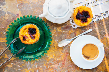 Conceived with the morning coffee and cakes (Pasteis de nata, typical pastry from Portugal) on natural marble surface.
