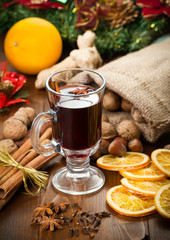 Mulled wine, cinnamon sticks, nuts, anise, ginger, carnation and dried orange slices