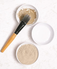 Fototapeta na wymiar Clay powder and water - facial mask ingredients
