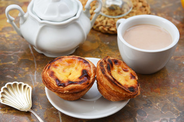 Conceived with the morning coffee and cakes (Pasteis de nata, typical pastry from Portugal) on natural marble surface.