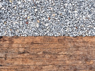 Wooden board and gravel texture background.