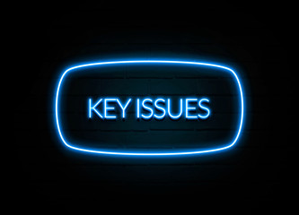 Key Issues  - colorful Neon Sign on brickwall