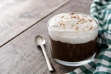 Chocolate mousse on wooden table. Copyspace