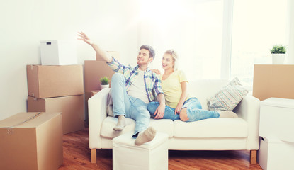 couple with boxes moving to new home and dreaming