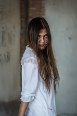 Portrait Zombie woman with bloody