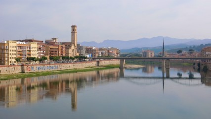 Obraz premium Tortosa, Catalonia, Spain riverside buildings reflected in River Ebro