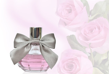 Female perfume in bottle with bow on a floral background