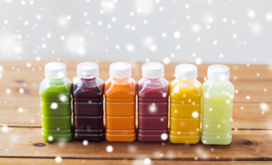 bottles with different fruit or vegetable juices