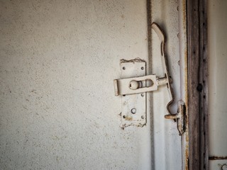 White metal door with lock.