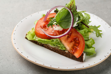 Toast with tomato and fresh greens