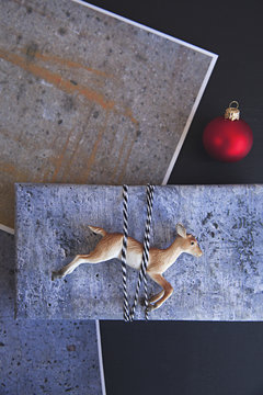 handmade / DIY concrete style gift wrap for Christmas on black background
