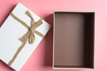 Gift box  on a pink background.