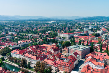 Fototapeta na wymiar Slovenia, Ljubljana - panoramic view from the top of The Ljubljana Castle. Summer noon sun photo