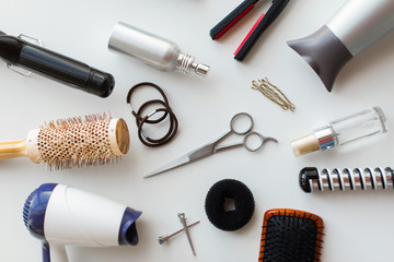 Fototapeta na wymiar scissors, hairdryers, irons and brushes