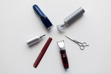 styling hair sprays, clippers, comb and scissors