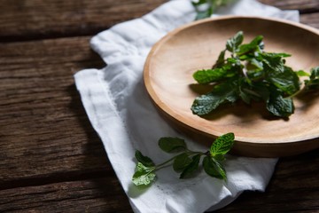Fresh mint leaves in wooden plate