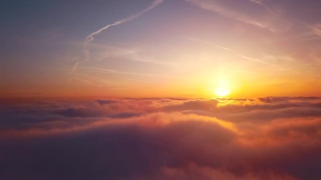 Time lapse video of floating clouds in sunset