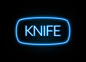 Fototapeta na wymiar Knife - colorful Neon Sign on brickwall
