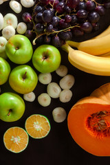 Fresh vegetables and fruits  over a dark background. the concept of a healthy diet, delivery services, cooking smoothies and vegetarian and vegan dishes, a green diet.