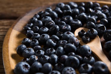 Blueberries in wooden plate