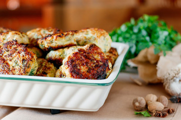Home meatballs with spices on a wood background