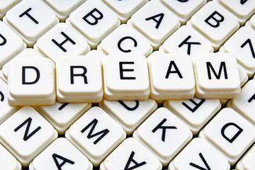 Dream word text lyrics cover title heading crossword blocks closeup photo.