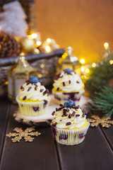 Christmas cupcakes with lights dark background