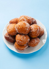 donuts filled with jam, marmalade or cream on a plate