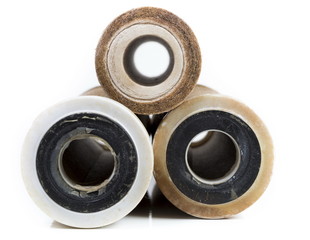Dirty water filter cartridges on white background