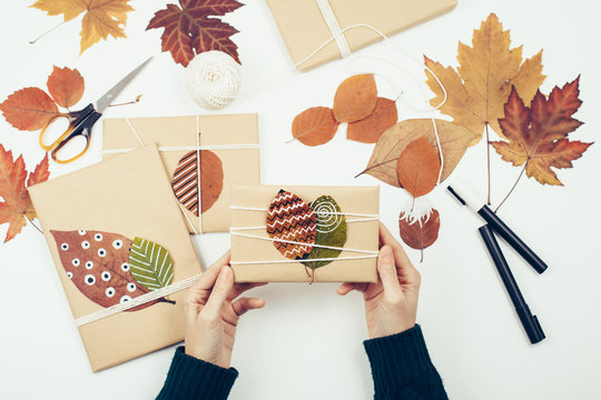 Woman preparing Christmas gifts presents