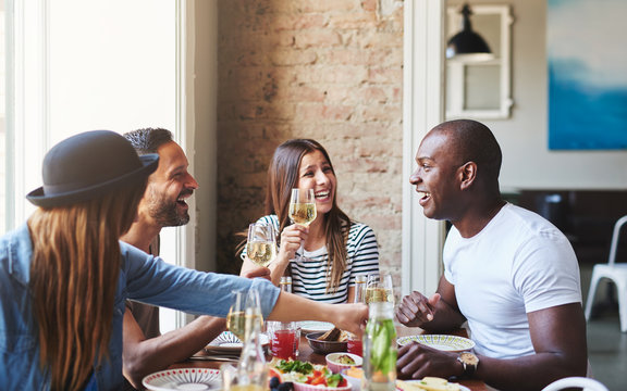 Attractive Black Man With Friends At Dinner