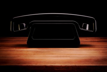 Retro looking modern telephone on table 