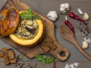 vegetables with meat and mushrooms baked in pumpkin. 