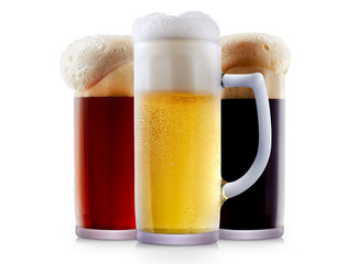 Mug collection of frosty dark red and light beer with foam isolated on a white background