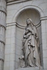 Fototapeta na wymiar Statue of saint Genevieve, patron of Paris, at saint Stephen Catholic church, religious landmark in the 5th arrondissement, Paris, France