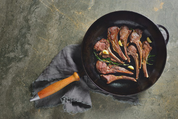 Lamb chops sauteed in a cast iron pan © fortyforks