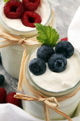 Fresh Yogurt. Breakfast with yogurt and blueberries and raspberrries