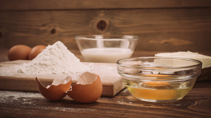 Dough recipe ingredients on vintage rural wood kitchen board