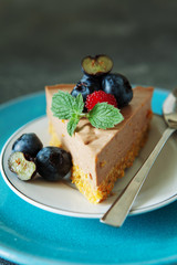  chocolate cheesecake with fresh blueberry and mint close up