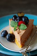  chocolate cheesecake with fresh blueberry and mint close up