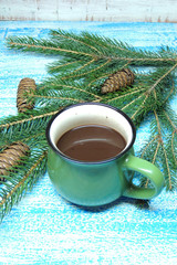 Hot chocolate and a Christmas tree. New Year background