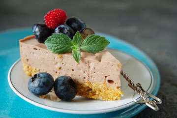  chocolate cheesecake with fresh blueberry and mint close up