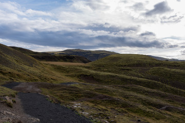 Green hills with thick clouds