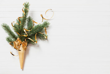 Christmas fir in waffle cone on white background