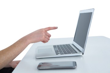 Cropped image of businesswoman gesturing on laptop