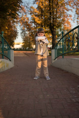 Little girl smiling and hide the face