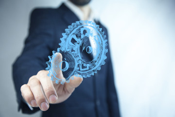 man hand  gears in screen