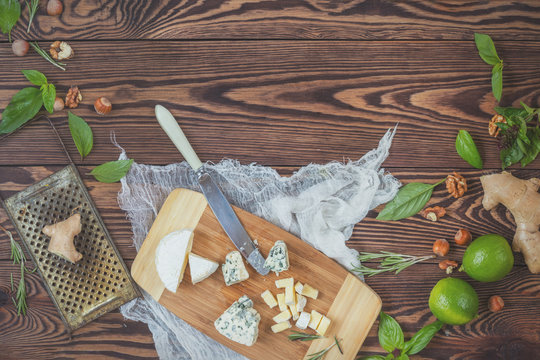 Top view of organic natural fresh healthy food and kitchen items on wooden background with copy space